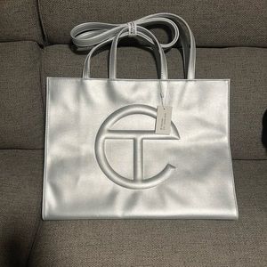Brand New, never worn, large Silver Telfar shopping bag.
